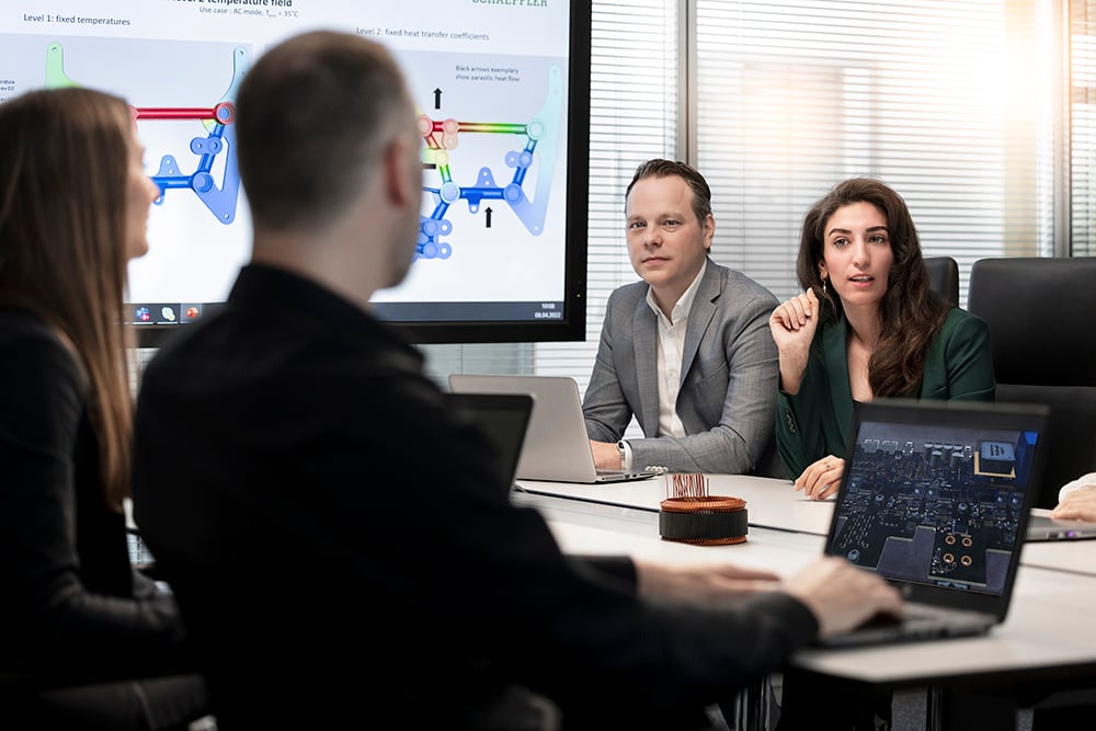 2.Group-of-engineers-discussing_683949_master