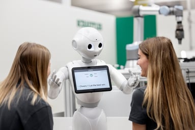 Female-students-interact-with-_Pepper_-a-humanoid-robot_large